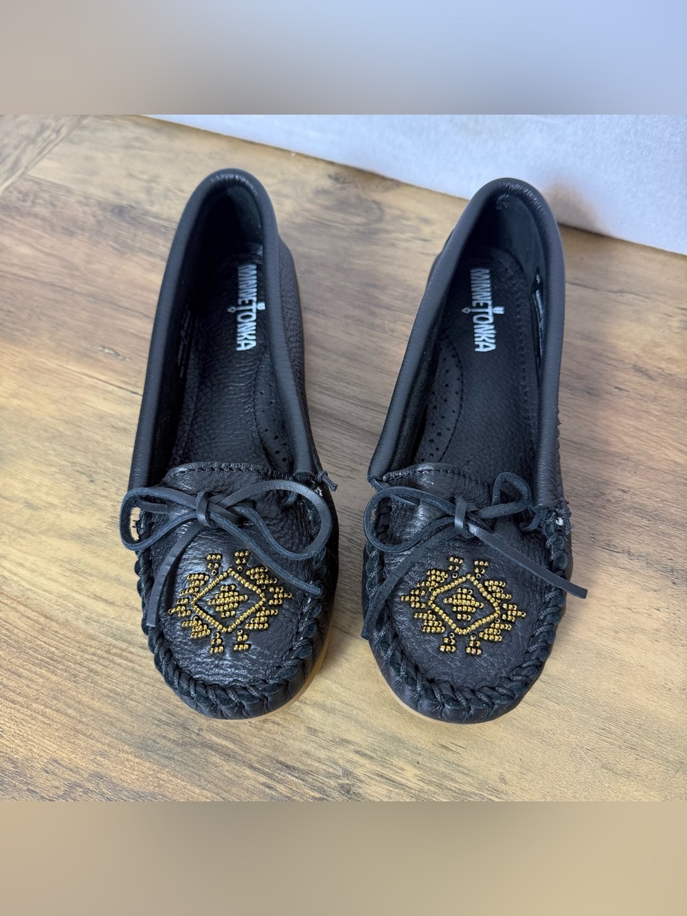 Minnetonka Women's Deerskin Gold Beaded Moccasin - Black - Size 6